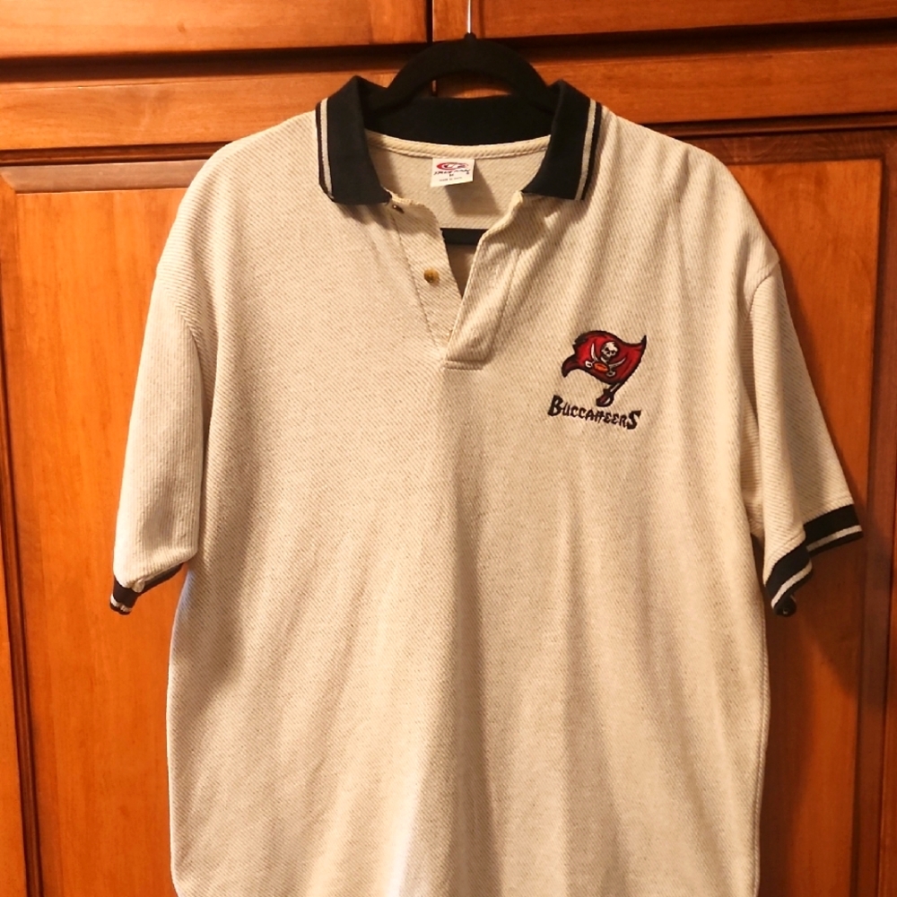 Buccaneer Men's Cream Polo Shirt with black accents and stitched logo.